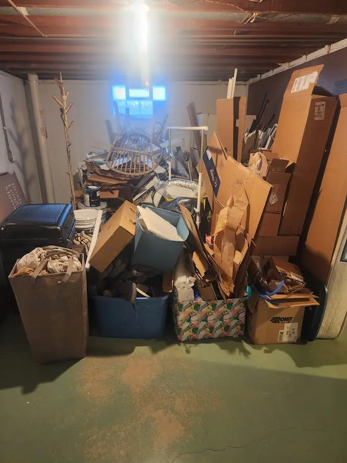 Roll-off dumpster container at job site for 8 Yard Dumpster Rental in Mancelona